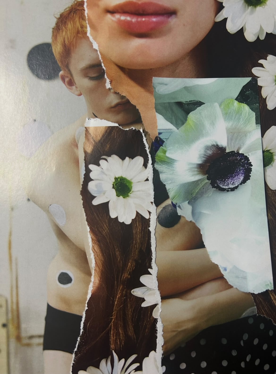 Torn-paper portrait layered with white daisies and pale flowers