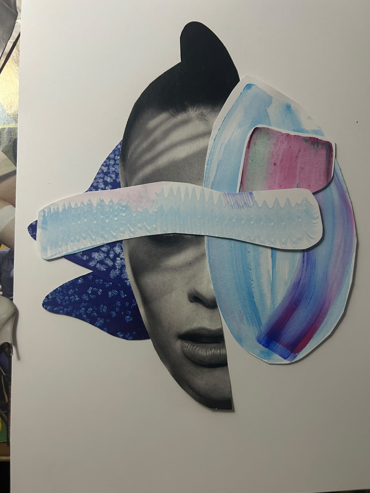 Monochrome portrait layered with blue and lilac painted paper